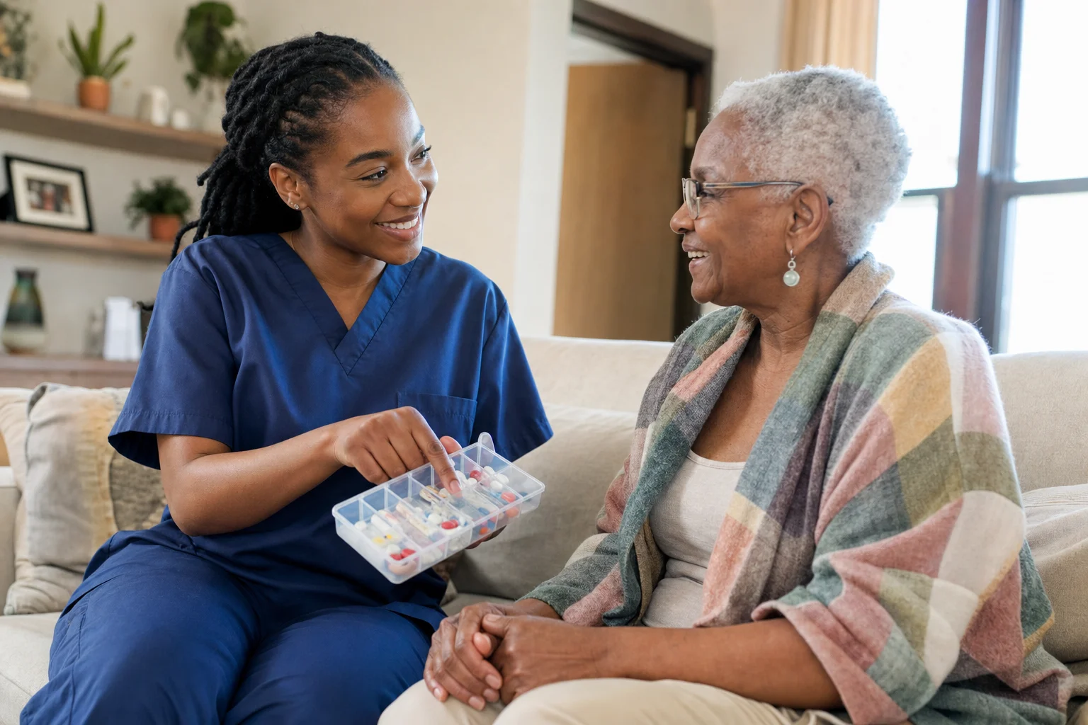 Caregiver assisting client with medication management at home